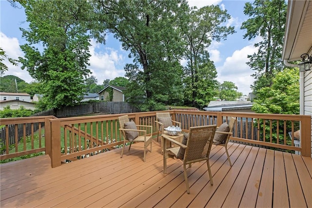 wooden terrace featuring fence