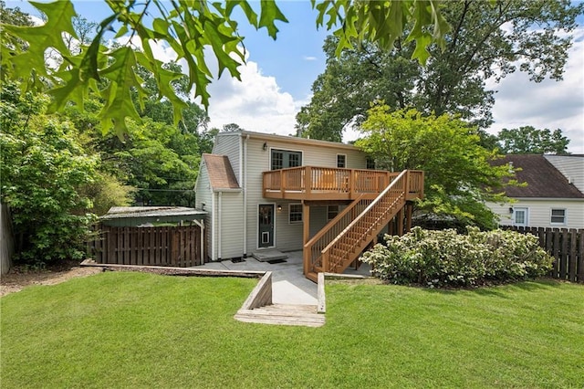 back of property featuring a wooden deck and stairway