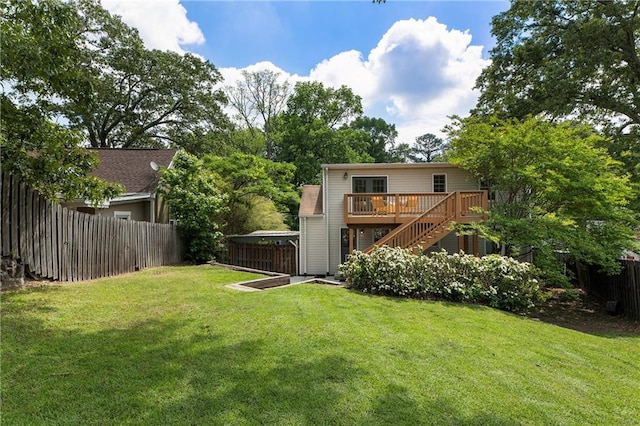 view of yard featuring stairway and a deck