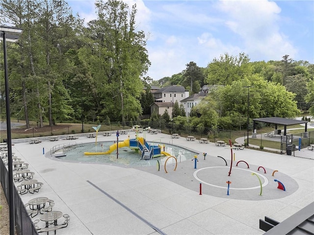 view of community featuring fence and a pool