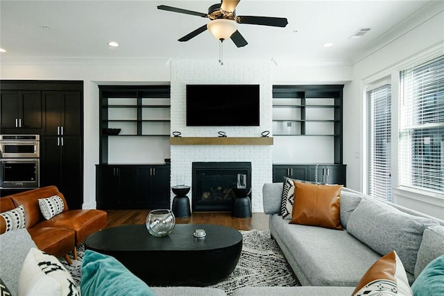 6666 Sterling Dr, Sandy Springs, GA 30328 - living room featuring a ceiling fan, wood finished floors, crown molding, a brick fireplace, and recessed lighting