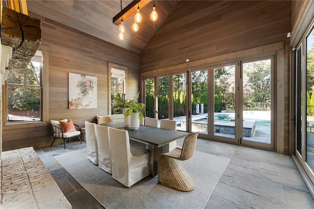 sunroom / solarium with lofted ceiling and wood ceiling