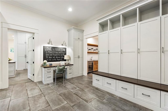 mudroom featuring ornamental molding