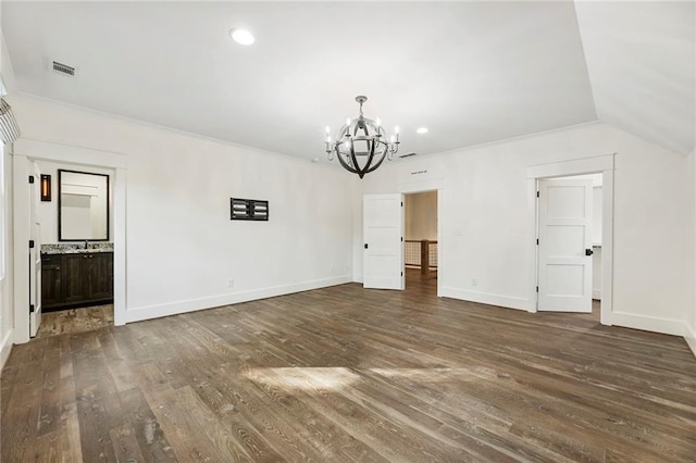 unfurnished dining area featuring lofted ceiling, a chandelier, and dark hardwood / wood-style flooring