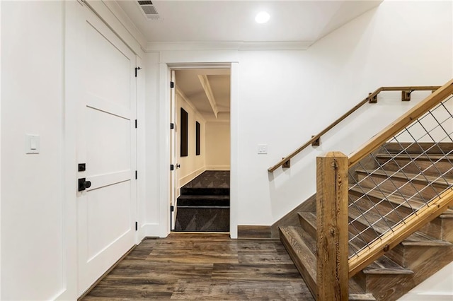 stairs featuring hardwood / wood-style flooring