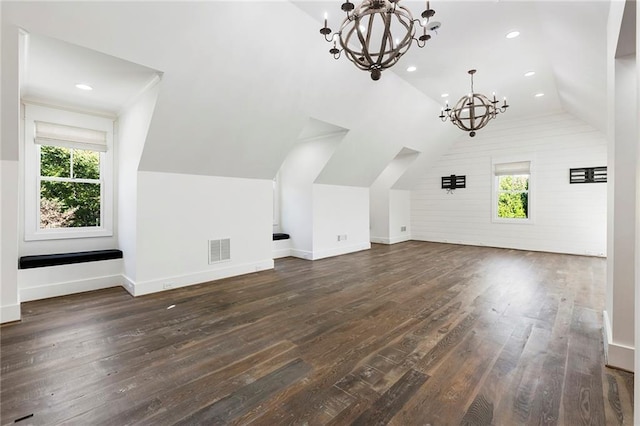 bonus room with a healthy amount of sunlight, lofted ceiling, and dark hardwood / wood-style flooring