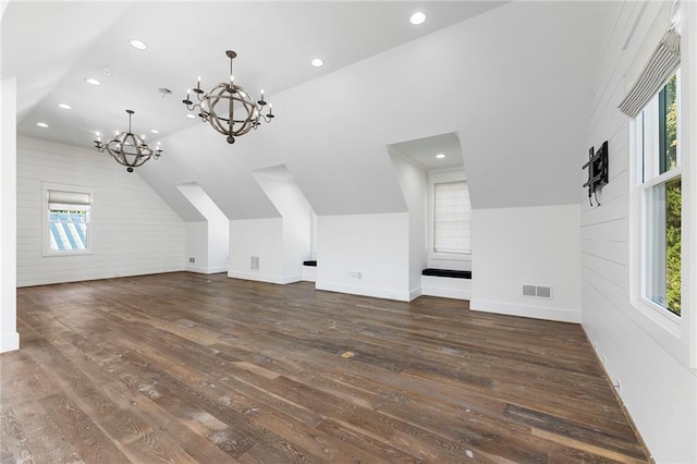 additional living space with dark hardwood / wood-style floors and a wealth of natural light