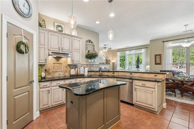kitchen with a center island, stainless steel dishwasher, a sink, light tile patterned floors, and a peninsula
