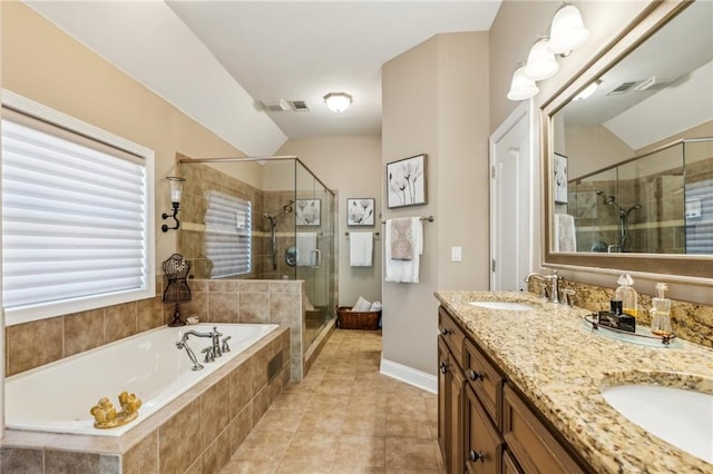 bathroom featuring double vanity, a garden tub, visible vents, a shower stall, and a sink