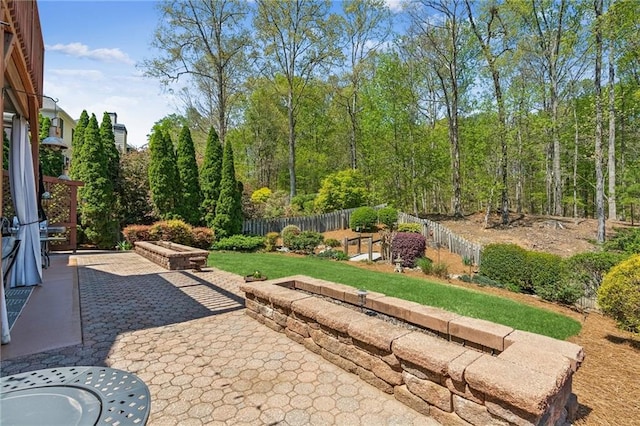 view of patio / terrace featuring fence