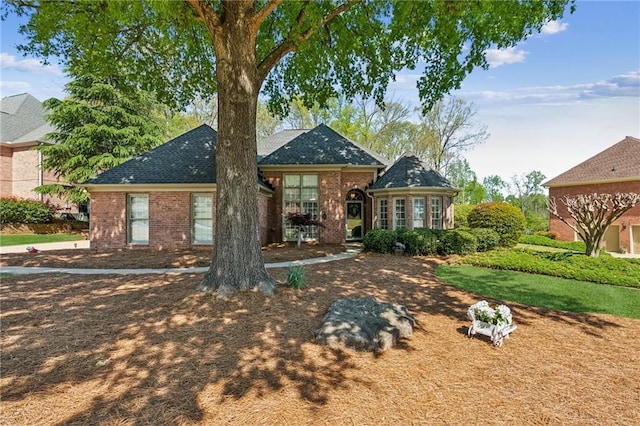 back of house with brick siding