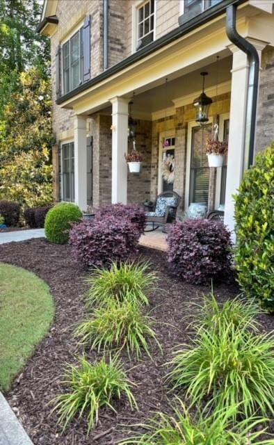 doorway to property featuring covered porch