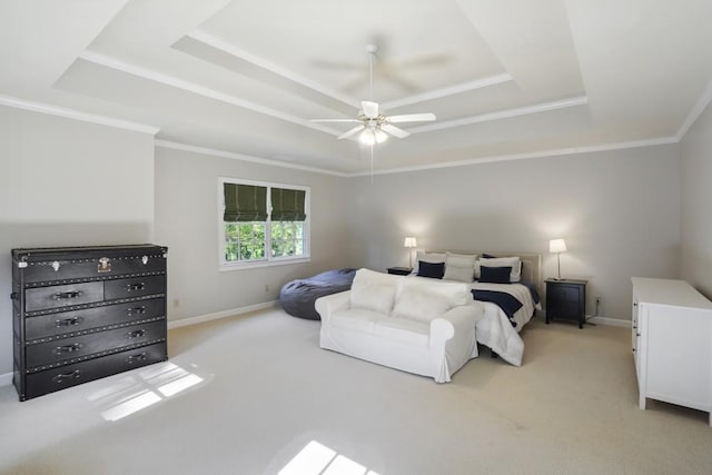 bedroom featuring baseboards, a raised ceiling, light carpet, and crown molding