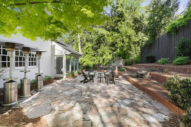 view of patio featuring fence