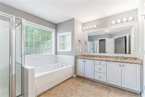 bathroom featuring vanity and plus walk in shower