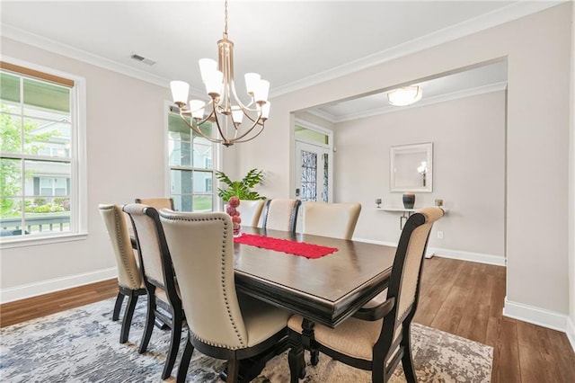 4110 Morgan Elizabeth Way, Cumming, GA 30041 - dining area with a chandelier, wood finished floors, baseboards, and crown molding