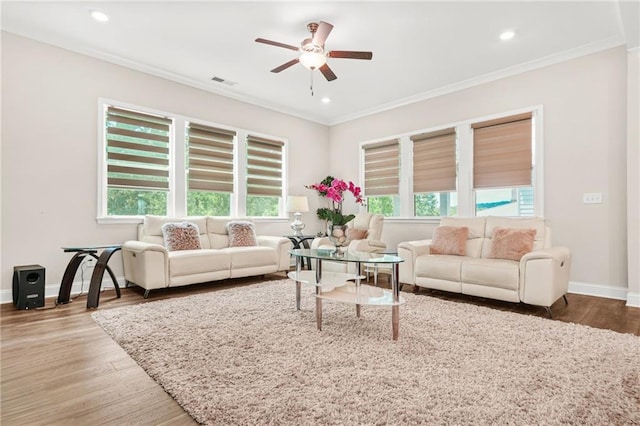 4110 Morgan Elizabeth Way, Cumming, GA 30041 - living area featuring ceiling fan, crown molding, healthy amount of natural light, wood finished floors, and baseboards
