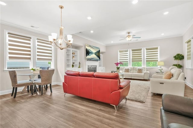4110 Morgan Elizabeth Way, Cumming, GA 30041 - living room featuring ornamental molding, a chandelier, wood finished floors, baseboards, and recessed lighting