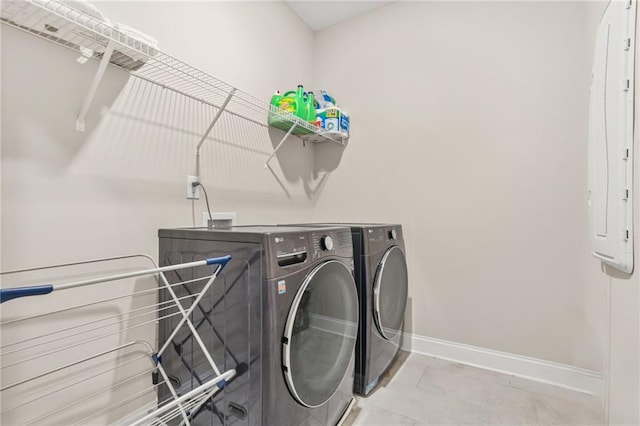 4110 Morgan Elizabeth Way, Cumming, GA 30041 - laundry area featuring baseboards and washing machine and dryer