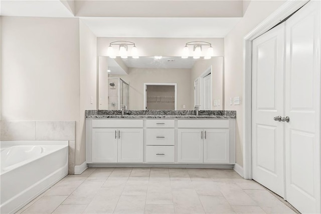 4110 Morgan Elizabeth Way, Cumming, GA 30041 - full bathroom featuring a closet, a stall shower, double vanity, a bath, and baseboards