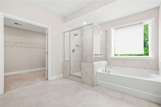 4110 Morgan Elizabeth Way, Cumming, GA 30041 - bathroom featuring a stall shower, a spacious closet, a garden tub, baseboards, and recessed lighting