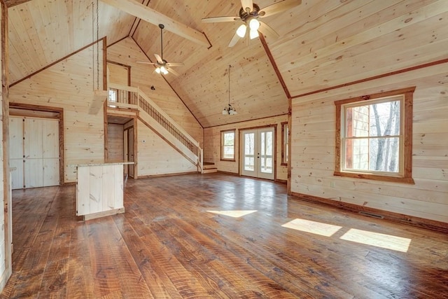 additional living space with dark wood-style flooring, wooden walls, ceiling fan, high vaulted ceiling, and wooden ceiling