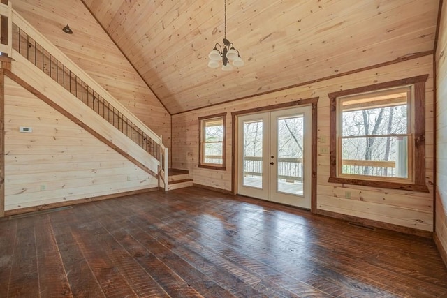 bonus room featuring a notable chandelier, french doors, vaulted ceiling, and dark wood finished floors