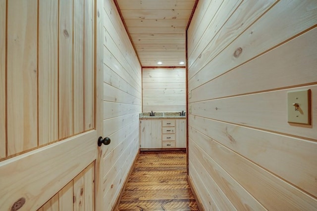interior space with wooden walls, recessed lighting, wooden ceiling, and wood finished floors