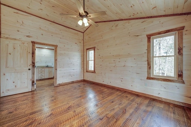 empty room with wooden ceiling, ceiling fan, hardwood / wood-style floors, and lofted ceiling