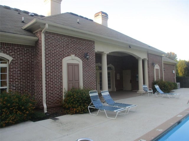 exterior space featuring a patio area and a community pool