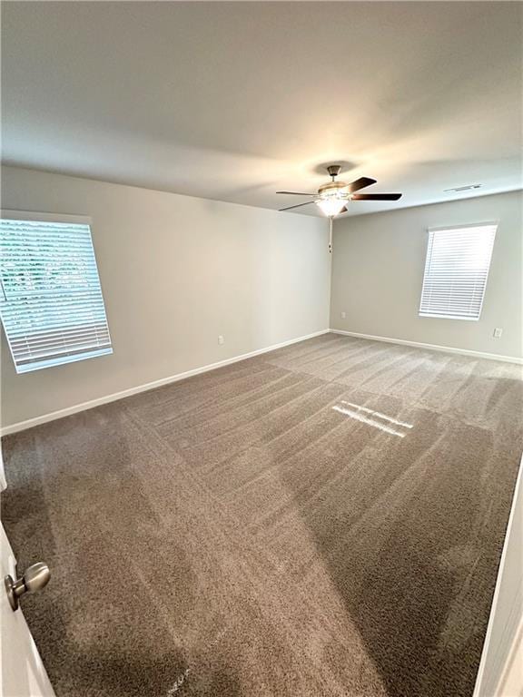 836 Courthouse Park Dr, Temple, GA 30179 - spare room with a ceiling fan, baseboards, and carpet floors