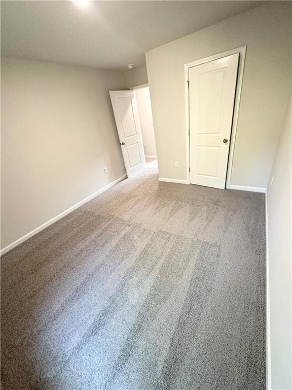 836 Courthouse Park Dr, Temple, GA 30179 - spare room featuring baseboards and carpet floors