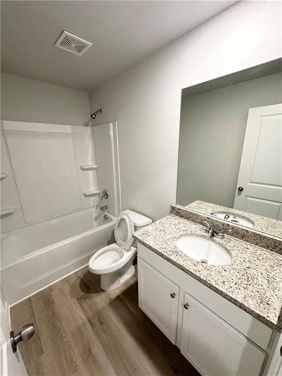 836 Courthouse Park Dr, Temple, GA 30179 - full bath featuring wood finished floors, toilet,  shower combination, and vanity