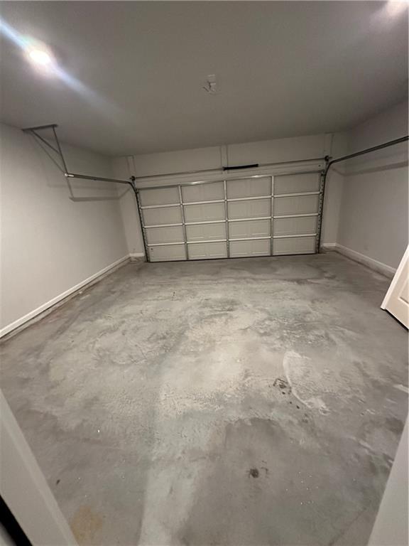 836 Courthouse Park Dr, Temple, GA 30179 - garage featuring baseboards