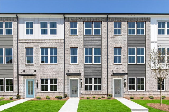 2682 Brookview Ln NW, Atlanta, GA 30318 - view of property featuring brick siding and a front lawn
