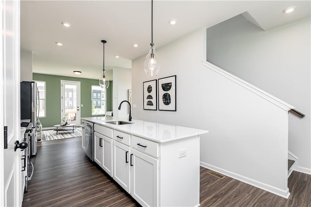 2682 Brookview Ln NW, Atlanta, GA 30318 - kitchen featuring an island with sink, white cabinetry, dark wood-type flooring, light countertops, and recessed lighting
