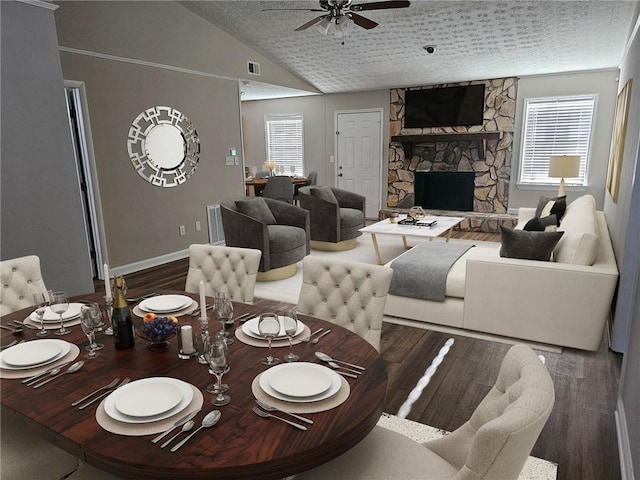 dining room with wood finished floors, lofted ceiling, plenty of natural light, and ceiling fan