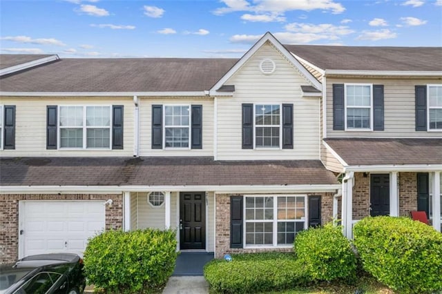 2183 Miranda Dr, Morrow, GA 30260 - view of property featuring brick siding, an attached garage, and roof with shingles