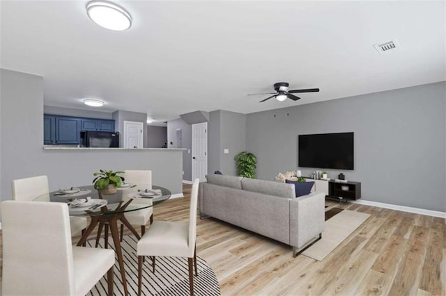 2183 Miranda Dr, Morrow, GA 30260 - living area with light wood-style floors and a ceiling fan