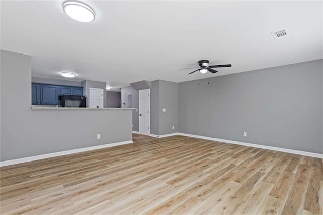 2183 Miranda Dr, Morrow, GA 30260 - unfurnished living room with ceiling fan and light wood-type flooring