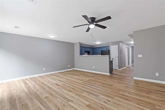 2183 Miranda Dr, Morrow, GA 30260 - unfurnished living room with ceiling fan and light wood-style flooring
