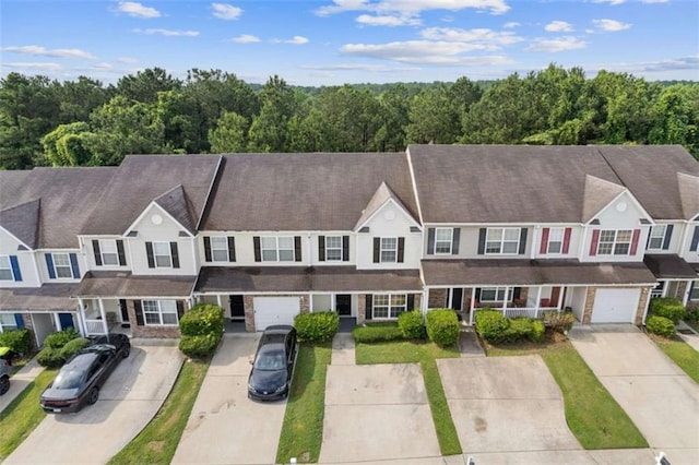 2183 Miranda Dr, Morrow, GA 30260 - view of front of property featuring driveway and a wooded view
