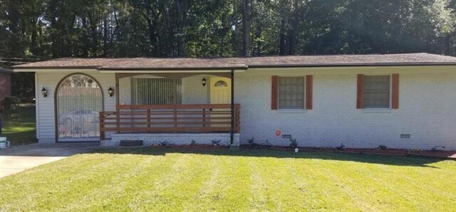 ranch-style house with a porch, brick siding, crawl space, and a front yard