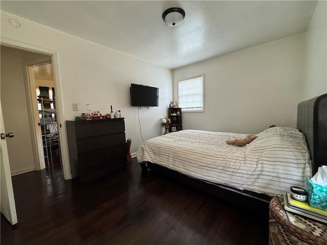 bedroom with wood finished floors