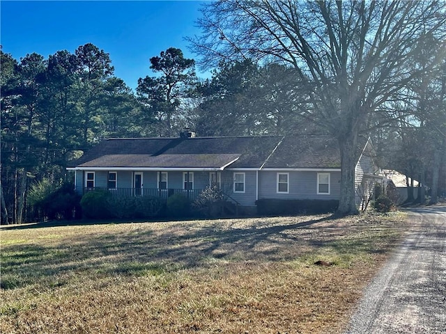 single story home featuring a front yard