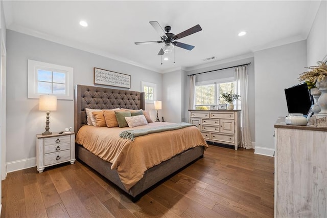 bedroom featuring ceiling fan, dark wood-type flooring, and crown molding