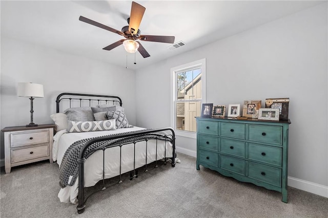 bedroom with ceiling fan and light carpet