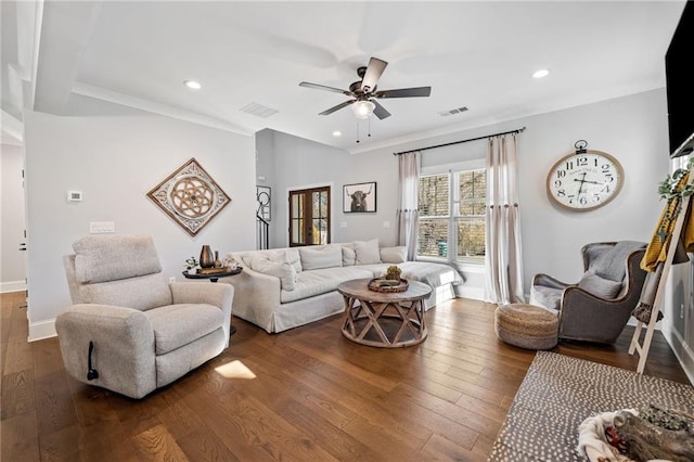 living room featuring ceiling fan and dark hardwood / wood-style floors