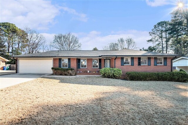 ranch-style house featuring a garage