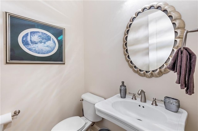 bathroom with sink and toilet